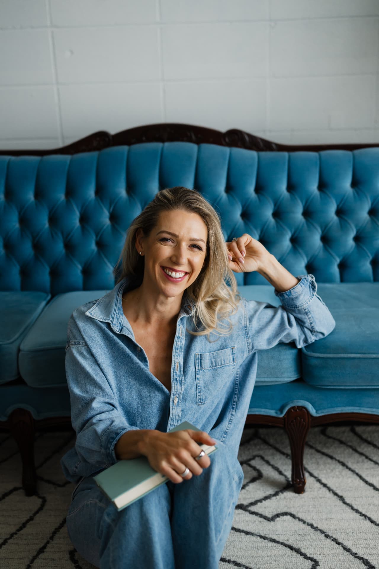 Mandy Balak, leadership coach, sitting and smiling